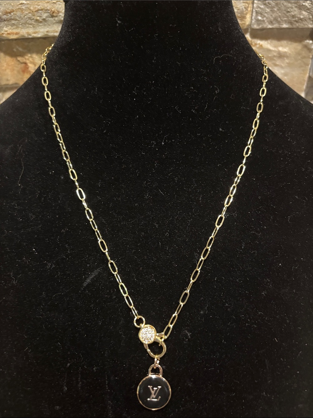 Gold-Tone Chain with a pave clasp and a  Black LV Round Pendant